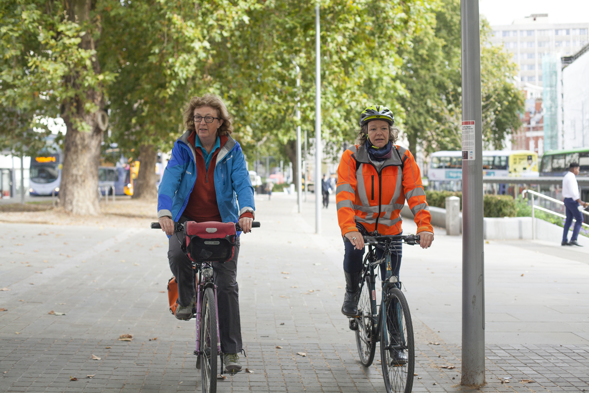 Two cyclists on the road in Bristol