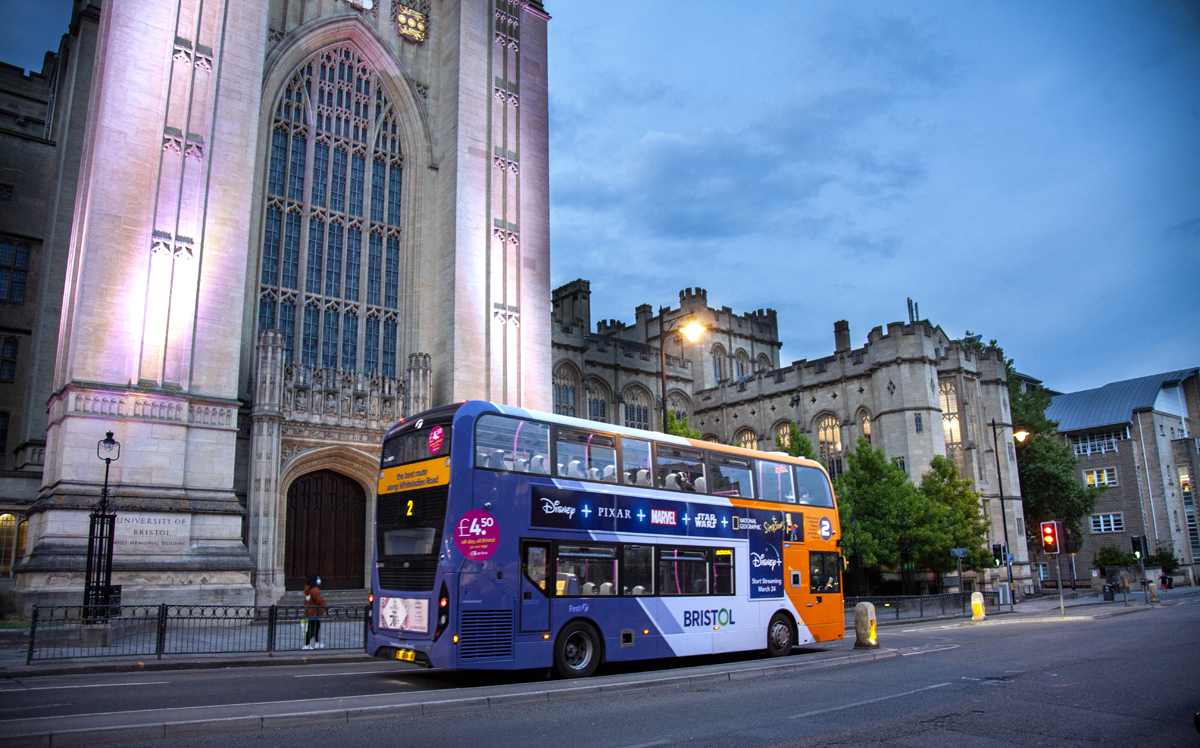 Bus outside a building evening shot