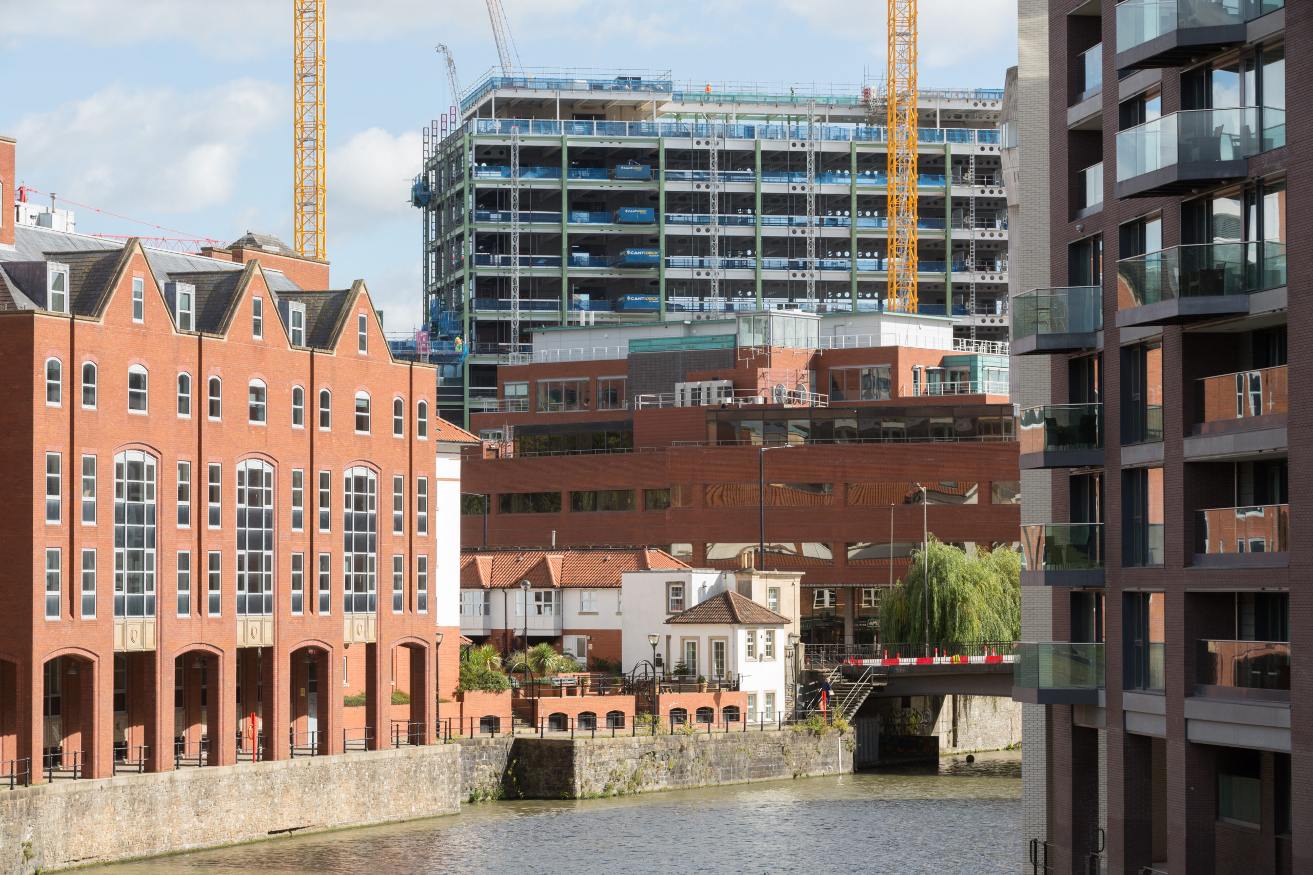 Buildings, cranes and river in Castle Park Bristol