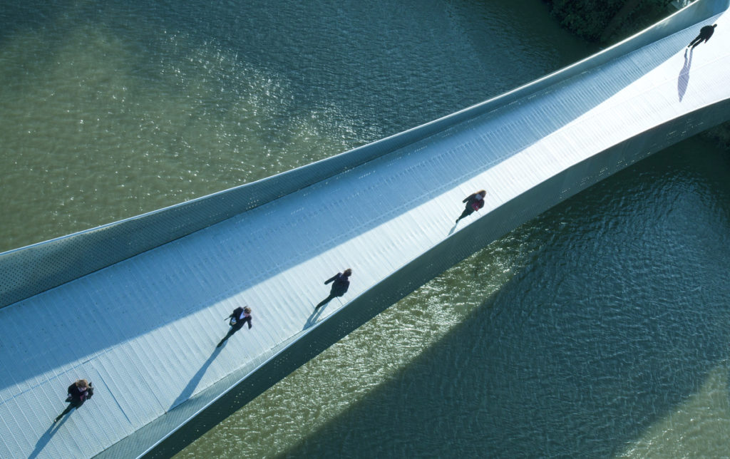 People walking over Temple Quay Bridge arial view