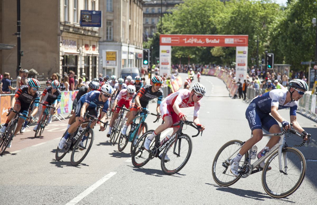 Bristol cycling Grand Prix showing cyclists going round a bend in the road