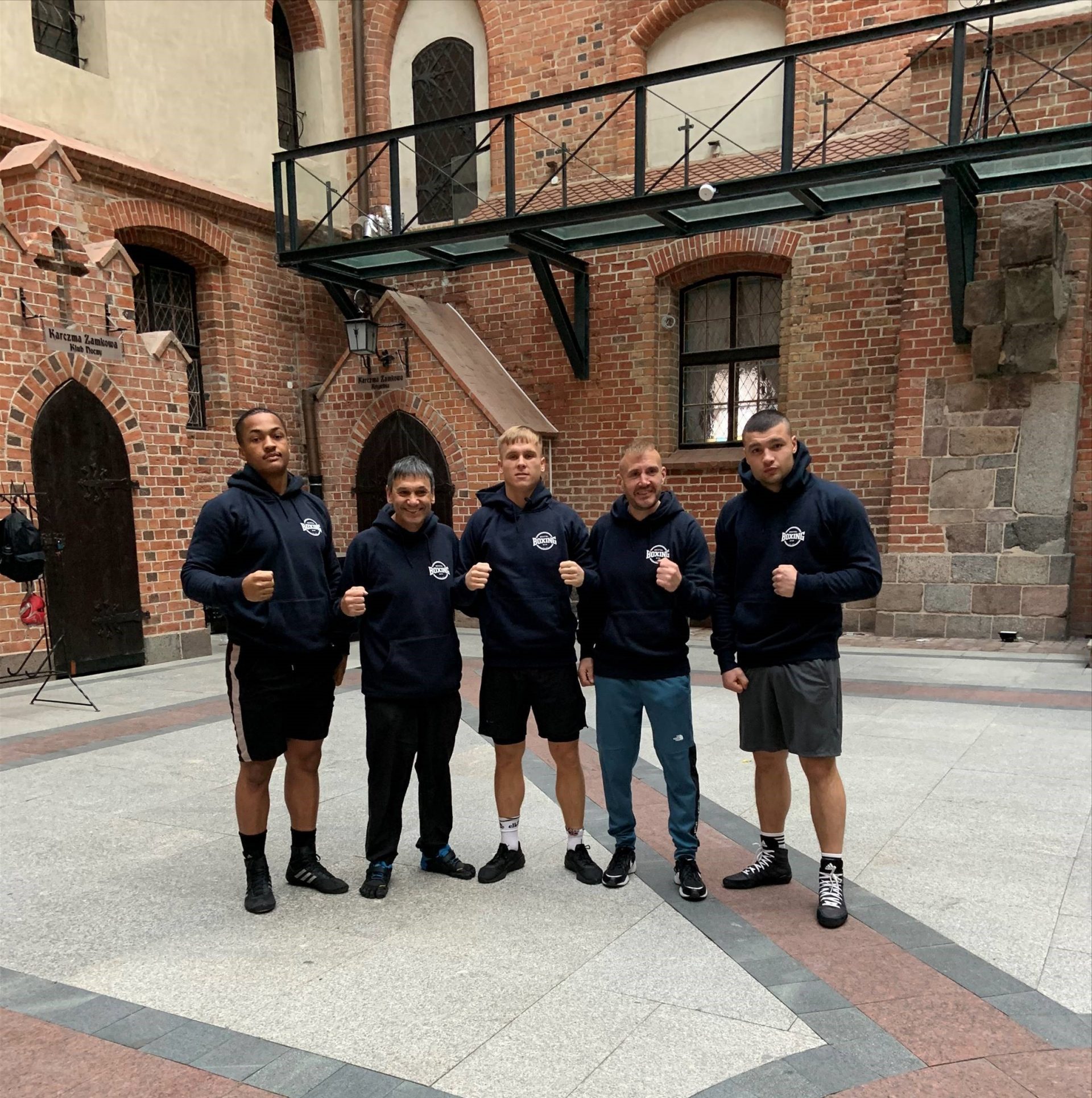 Group shot of young boxers together outside a building - Chris second from left